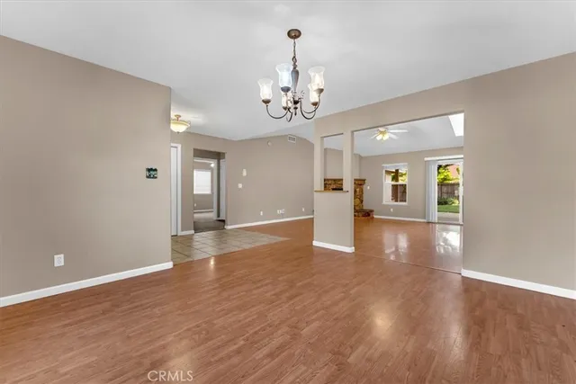 a view of a livingroom with a fireplace and wooden floor
