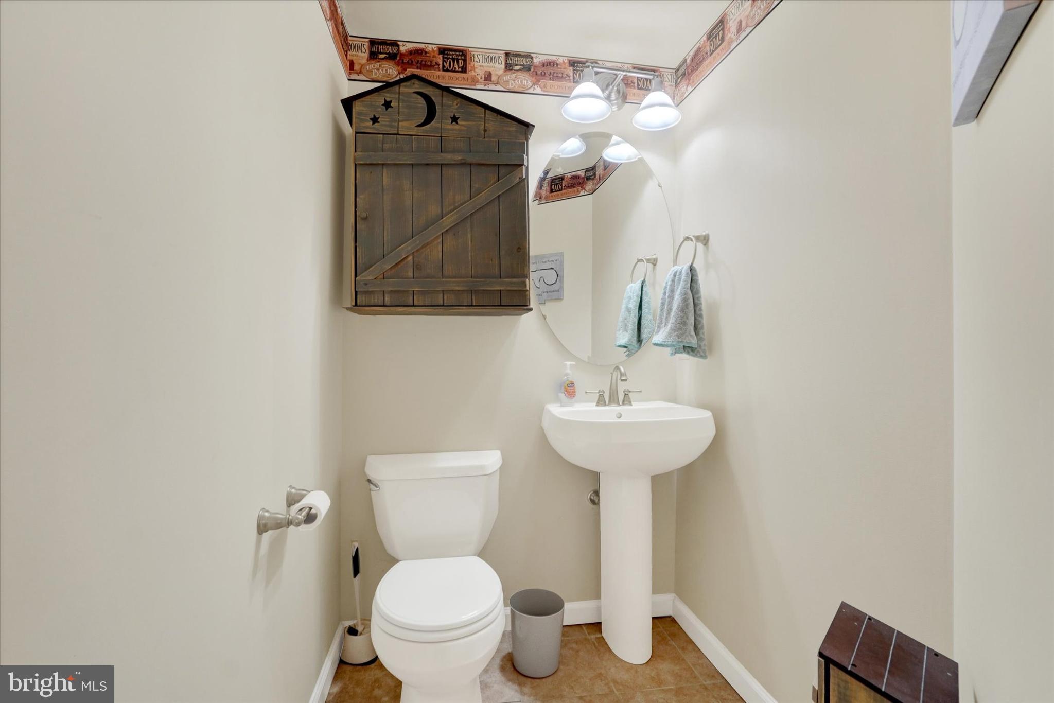 258 North Front Street New Freedom, PA 17349 - Photo 17 of 33 a bathroom with a toilet sink and mirror
