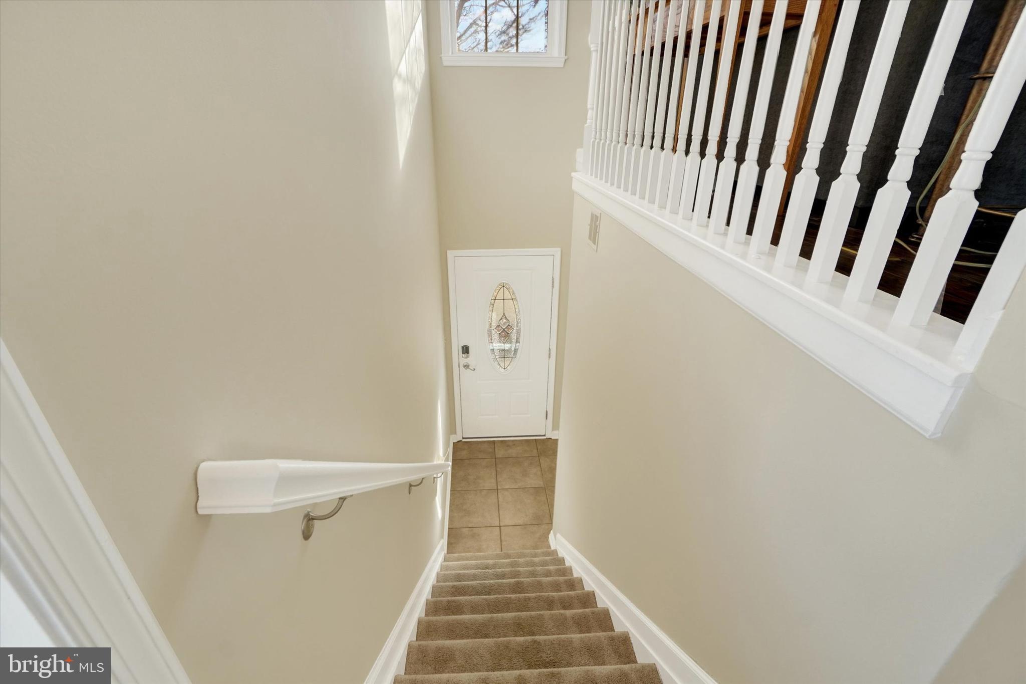 258 North Front Street New Freedom, PA 17349 - Photo 3 of 33 a view of a hallway with wooden floor and staircase