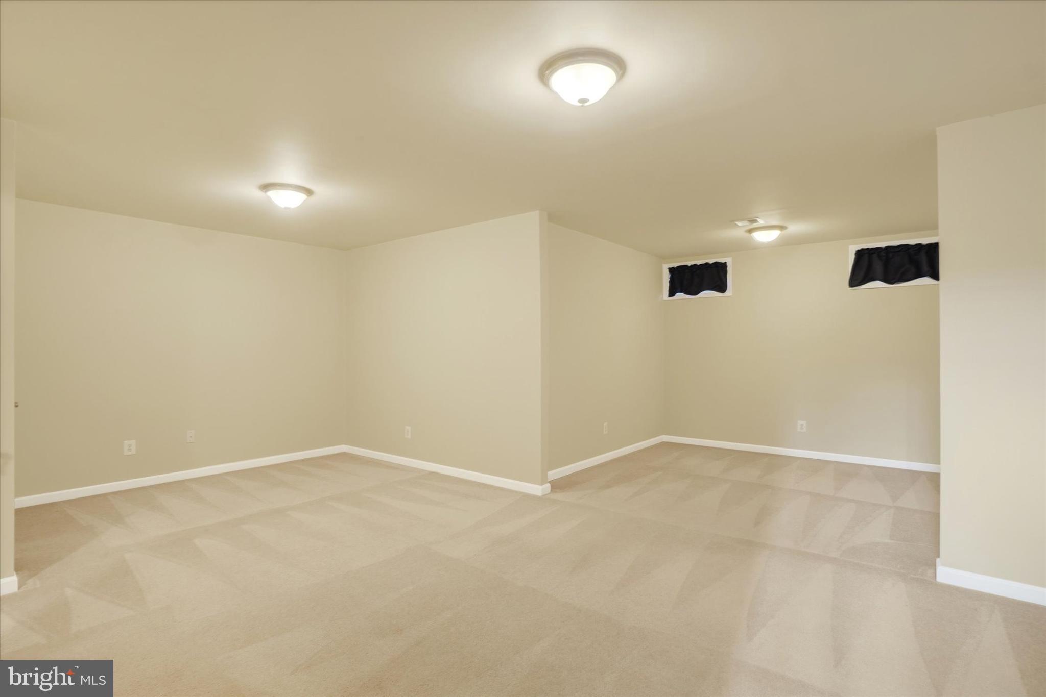 258 North Front Street New Freedom, PA 17349 - Photo 4 of 33 an empty room with windows and painted walls