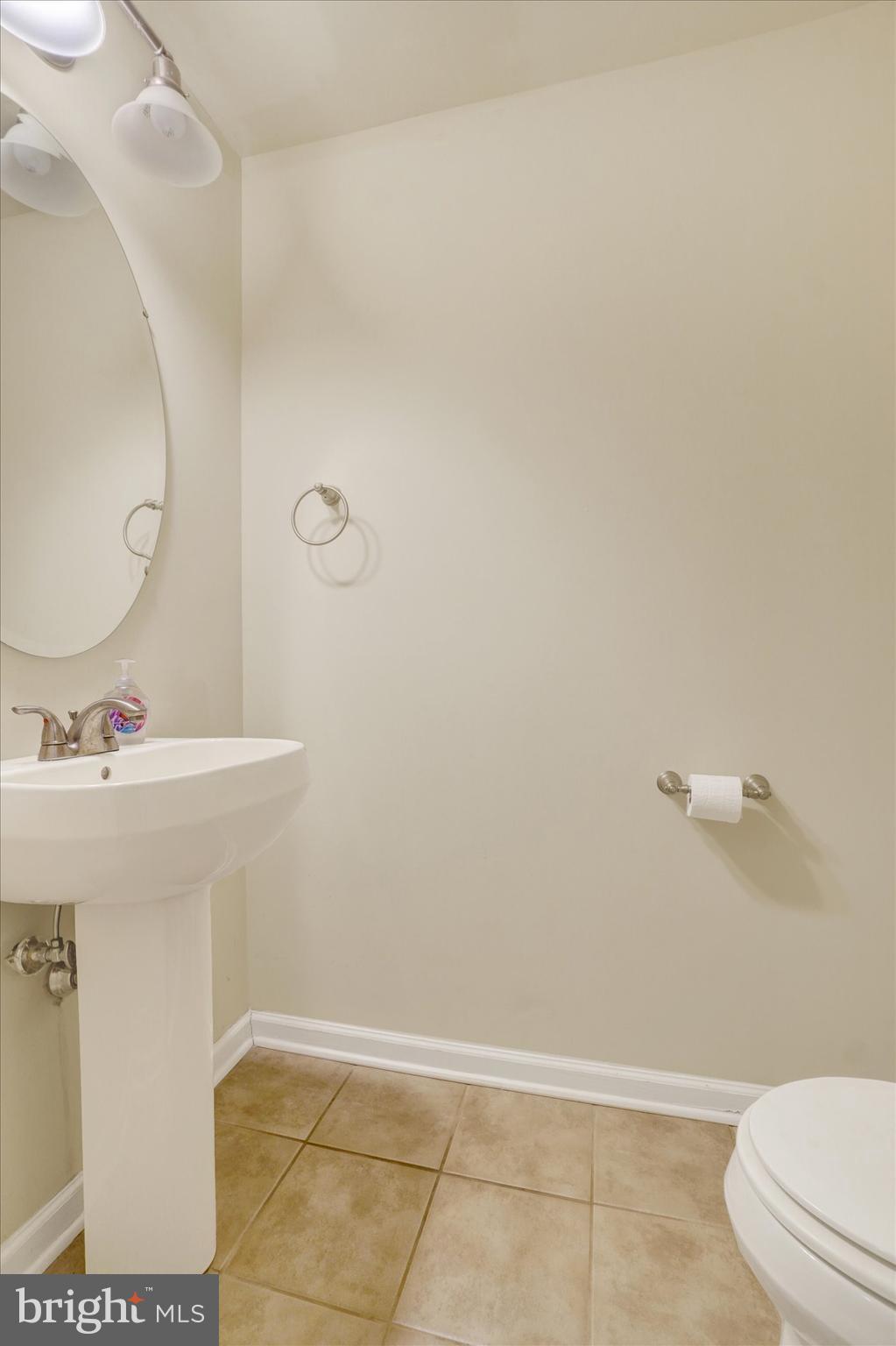 258 North Front Street New Freedom, PA 17349 - Photo 7 of 33 a bathroom with a sink a toilet and a mirror