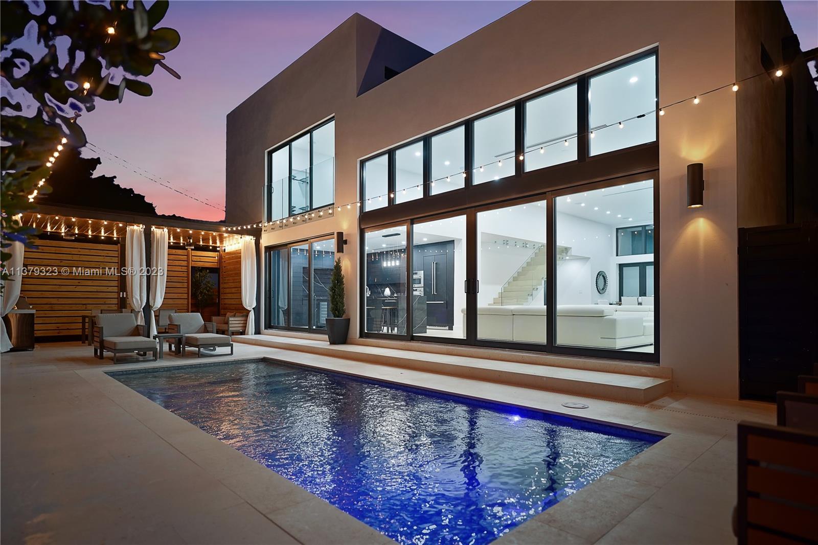 a view of swimming pool with an outdoor seating