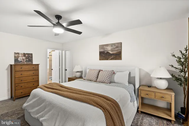 a bedroom with a bed and furniture