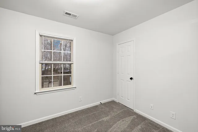a view of empty room with windows