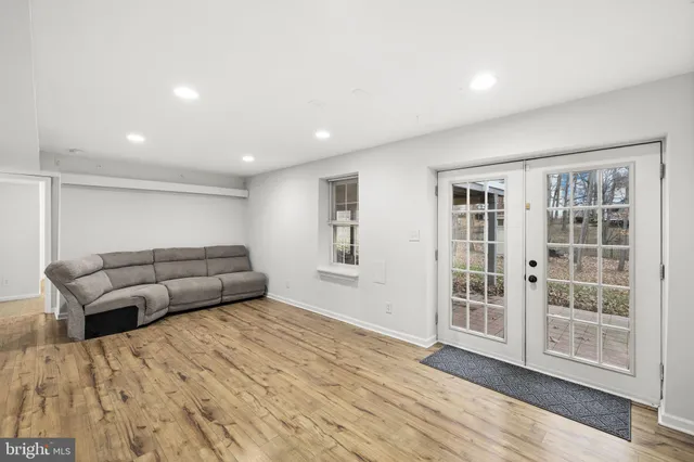 a living room with furniture and windows