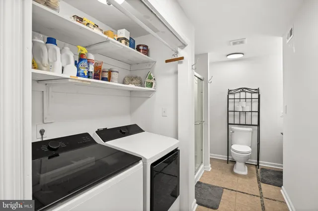 a kitchen with a refrigerator and a sink