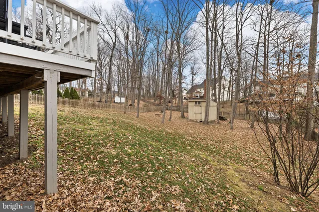 a view of a pathway with a wrought fence