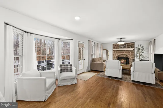 a living room with furniture fireplace and flat screen tv