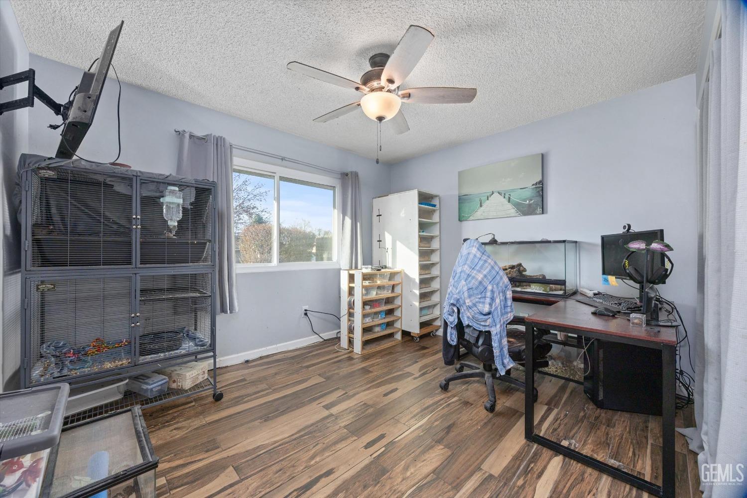 Undisclosed Address Bakersfield, CA 93308 - Photo 19 of 33 a workspace with wooden floor