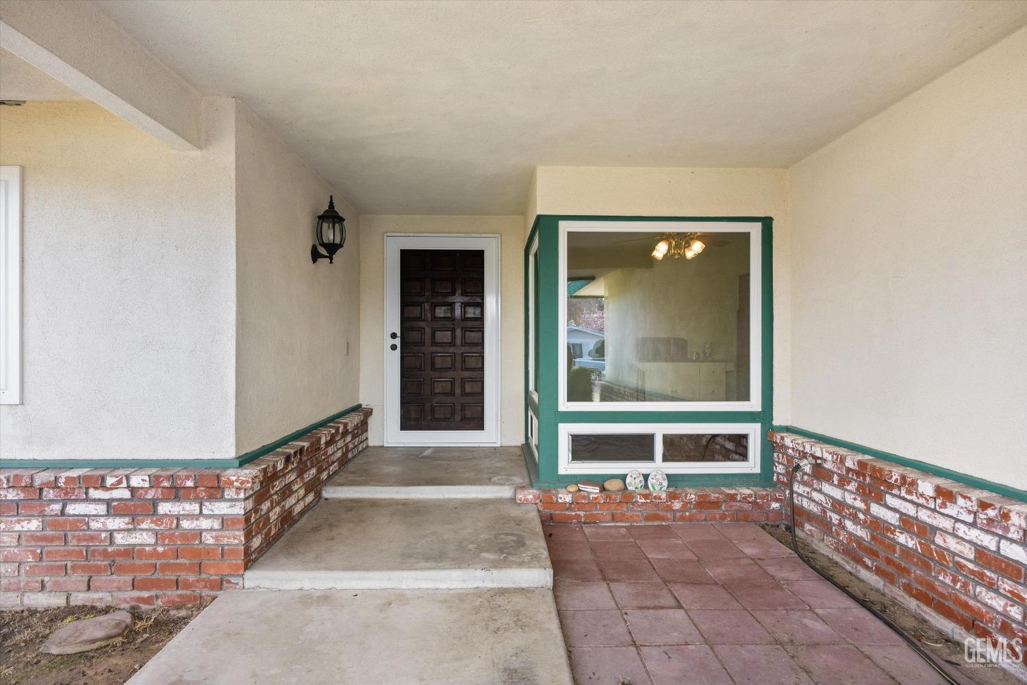 Undisclosed Address Bakersfield, CA 93308 - Photo 2 of 33 a view of a entryway door of the house