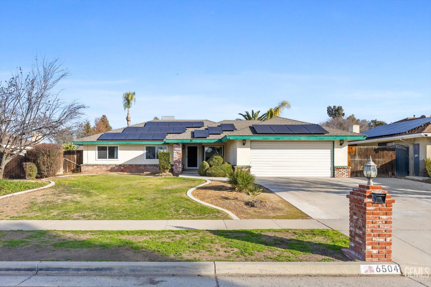 Undisclosed Address Bakersfield, CA 93308 - Photo 27 of 33 a front view of a house with garden