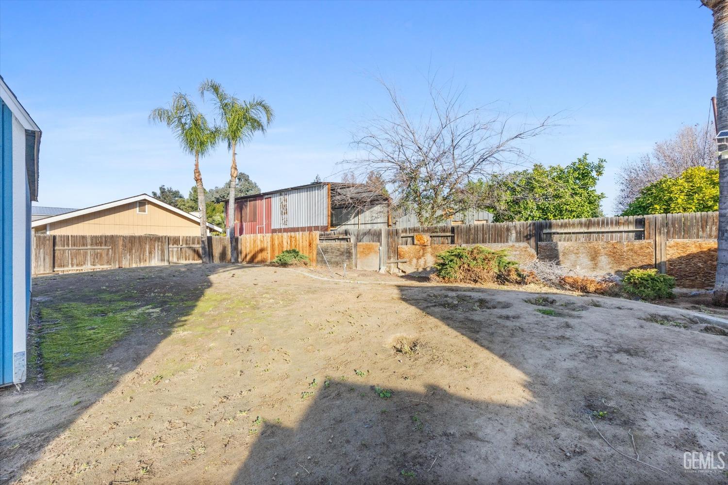 Undisclosed Address Bakersfield, CA 93308 - Photo 31 of 33 a view of a house with a yard and sitting area