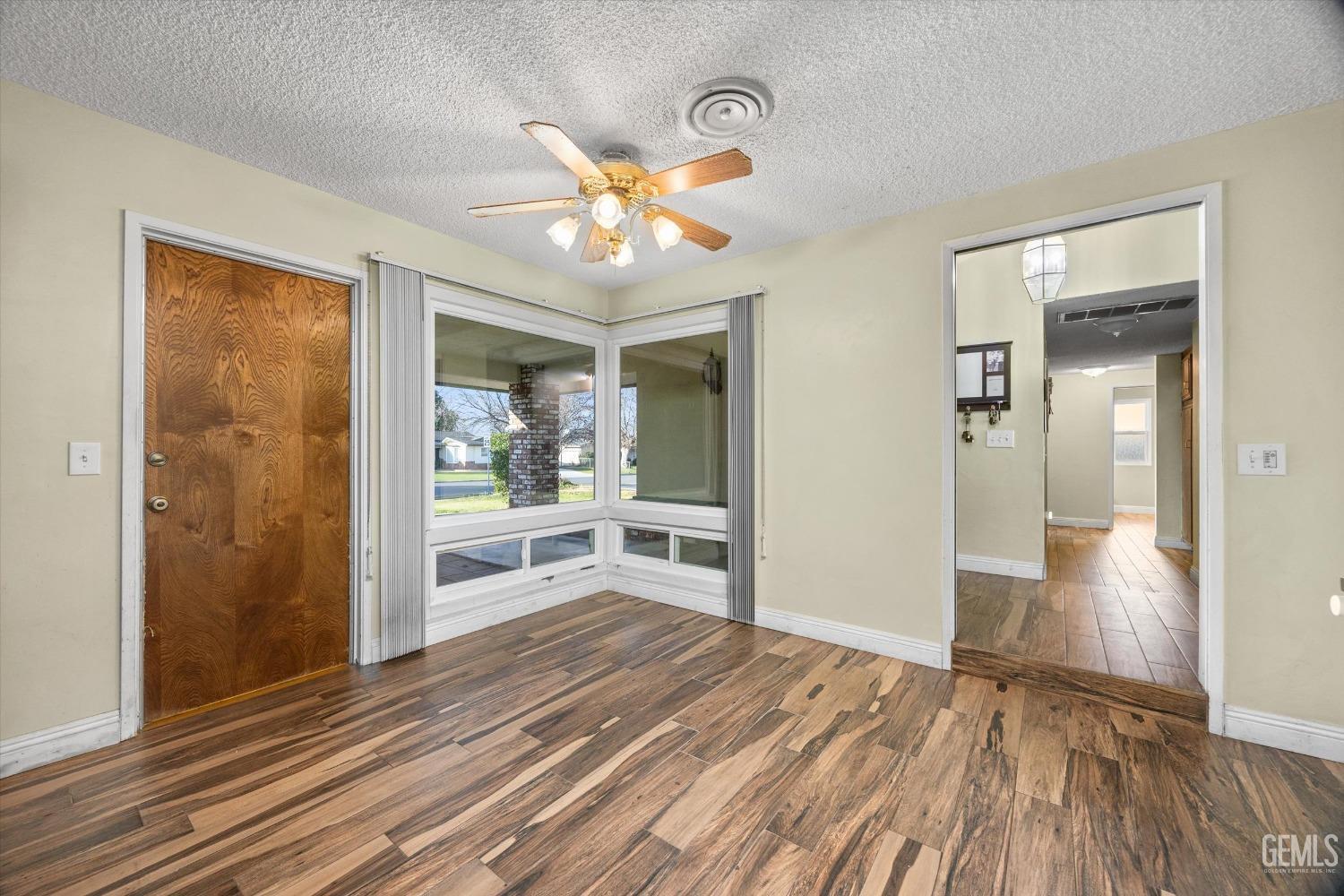 Undisclosed Address Bakersfield, CA 93308 - Photo 5 of 33 a view of a livingroom with wooden floor