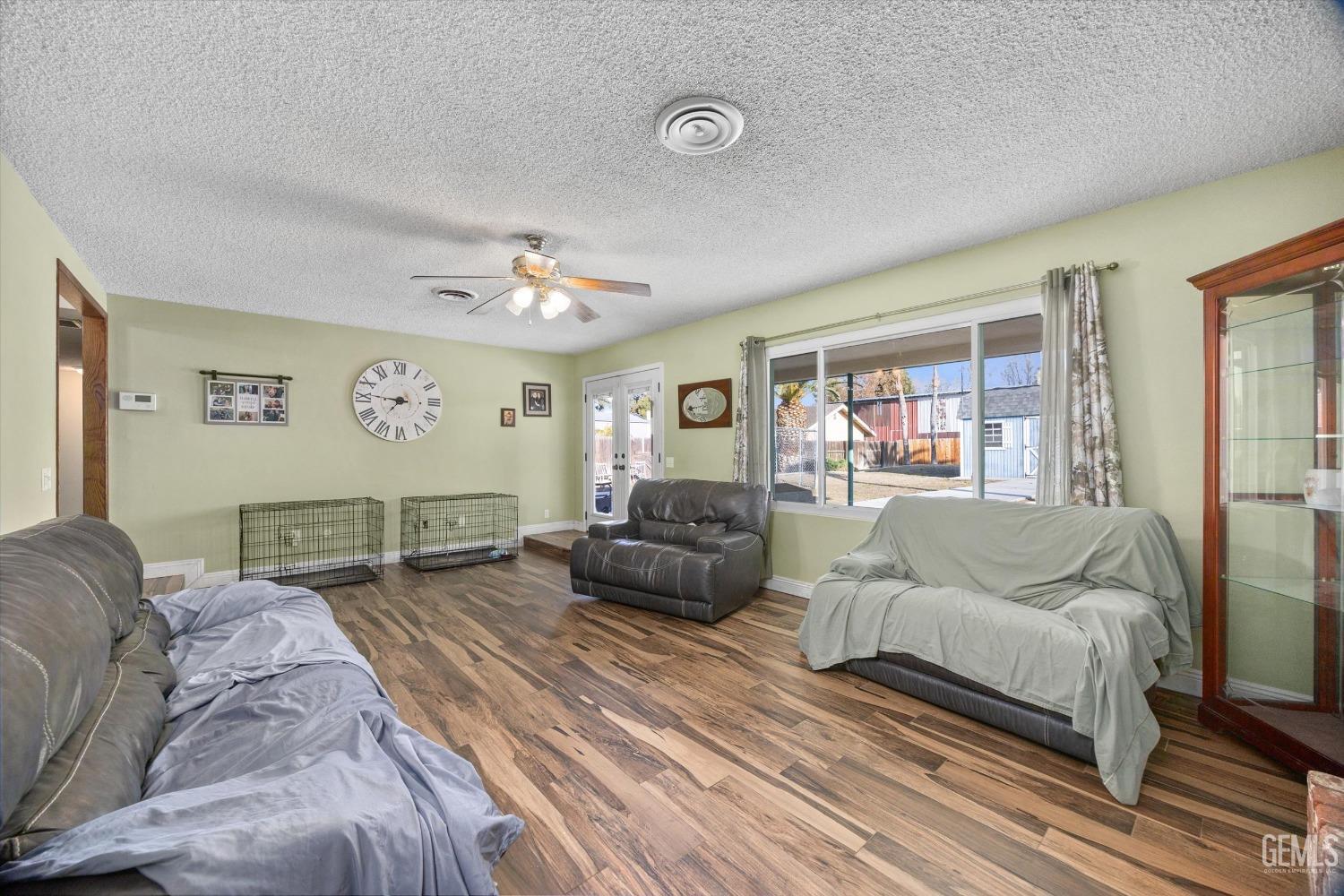 Undisclosed Address Bakersfield, CA 93308 - Photo 8 of 33 a living room with furniture and a large window