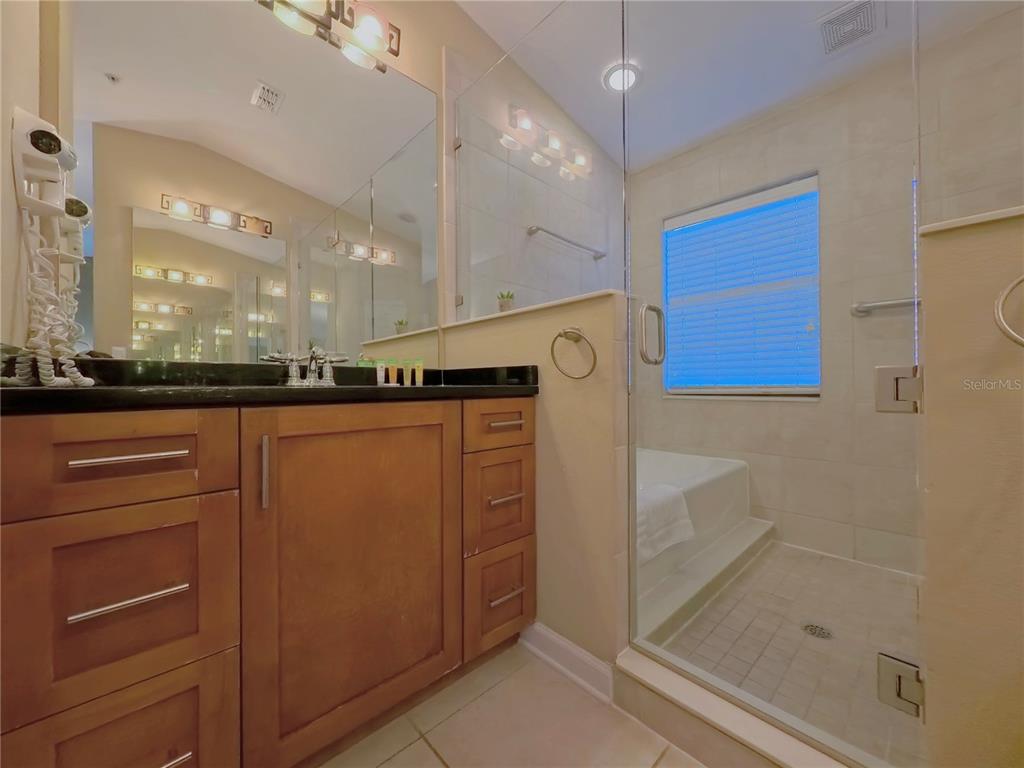14525 Damai Lane Orlando, FL 32821 - Photo 17 of 30 a bathroom with a shower