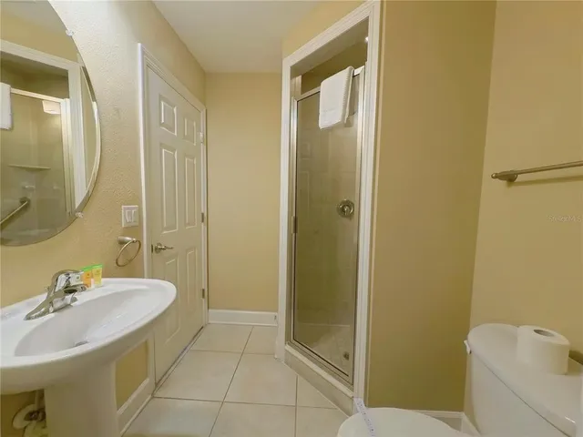 an outdoor space with patio and white umbrellas