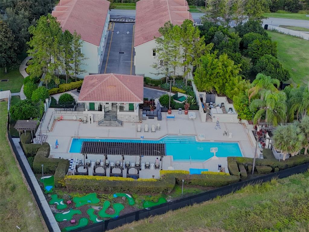 14525 Damai Lane Orlando, FL 32821 - Photo 26 of 30 an aerial view of a house with swimming pool and garden