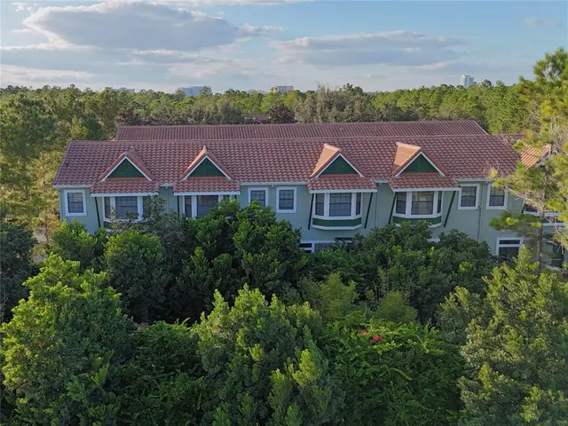 an aerial view of a house with a garden