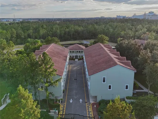 an aerial view of a house with outdoor space patio and outdoor seating