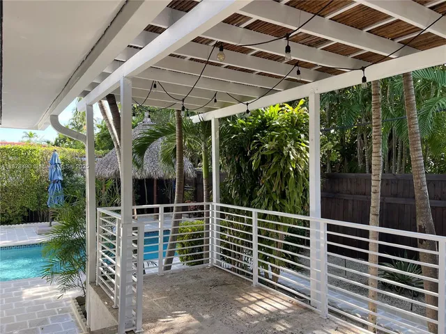 a view of a chair and table in the patio