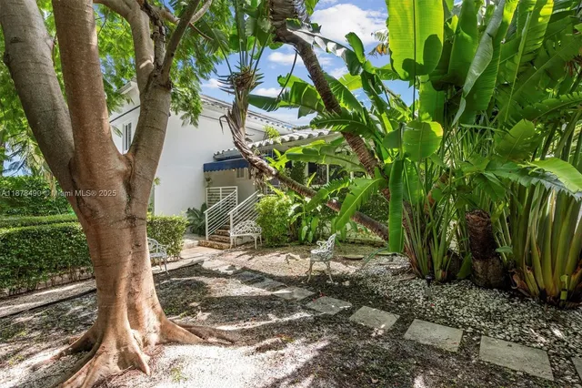 a backyard of a house with lots of green space