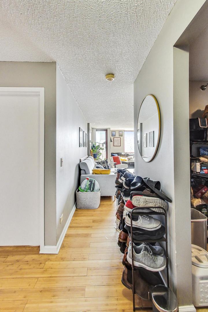 Undisclosed Address Chicago, IL 60601 - Photo 3 of 22 a bed room with a bed and a chair