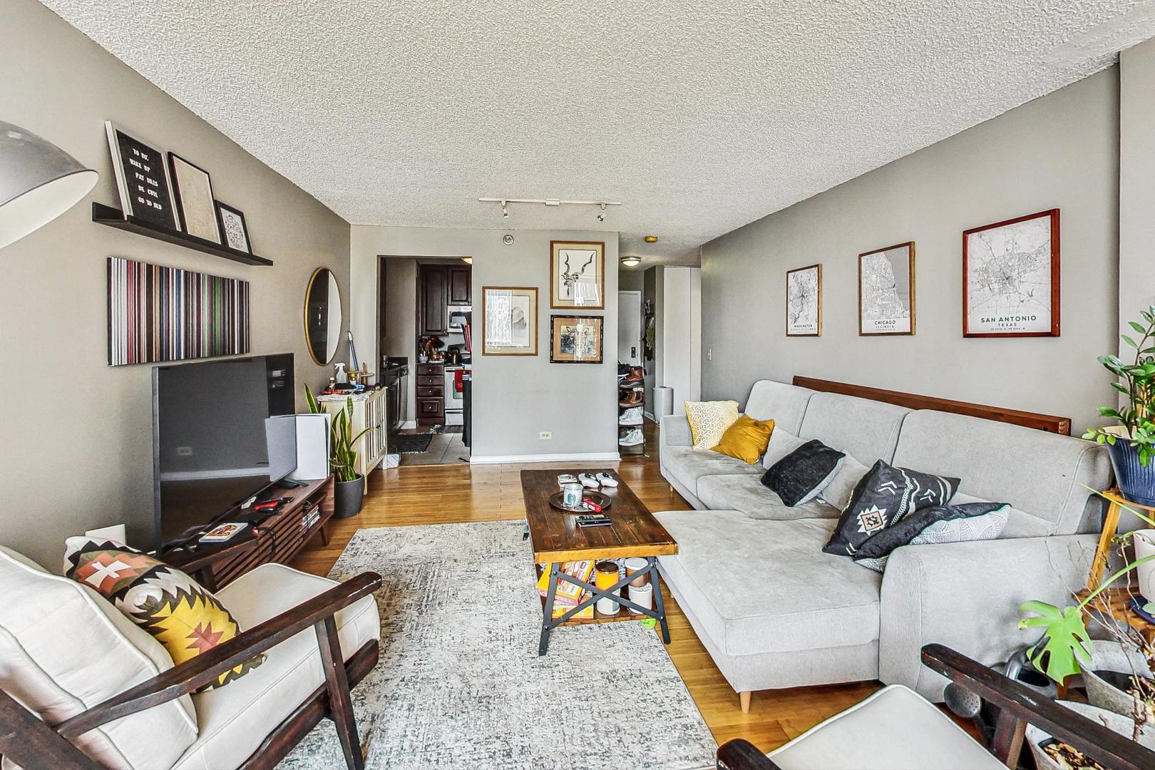 Undisclosed Address Chicago, IL 60601 - Photo 6 of 22 a living room with furniture and a table