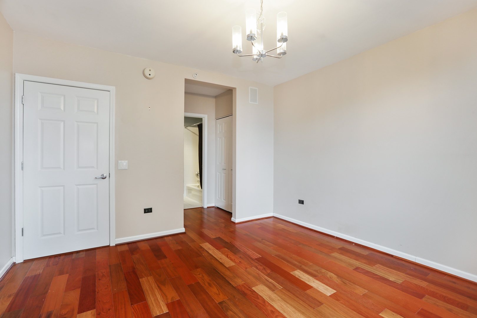 630 North State Street, Unit 1609 Chicago, IL 60654 - Photo 14 of 22 a view of empty room with wooden floor