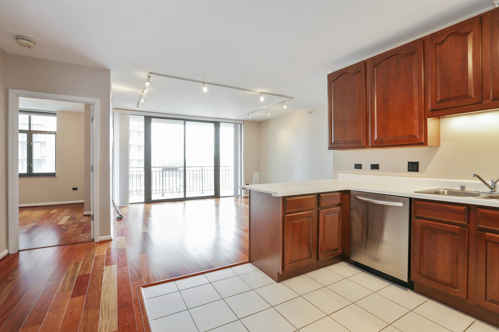 630 North State Street, Unit 1609 Chicago, IL 60654 - Photo 8 of 22 a kitchen with stainless steel appliances granite countertop a stove a sink and a refrigerator