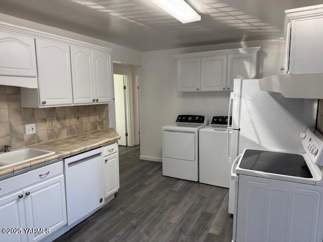 604 South 3rd Street Selah, WA 98942 - Photo 4 of 16 a kitchen with white cabinets sink and white appliances