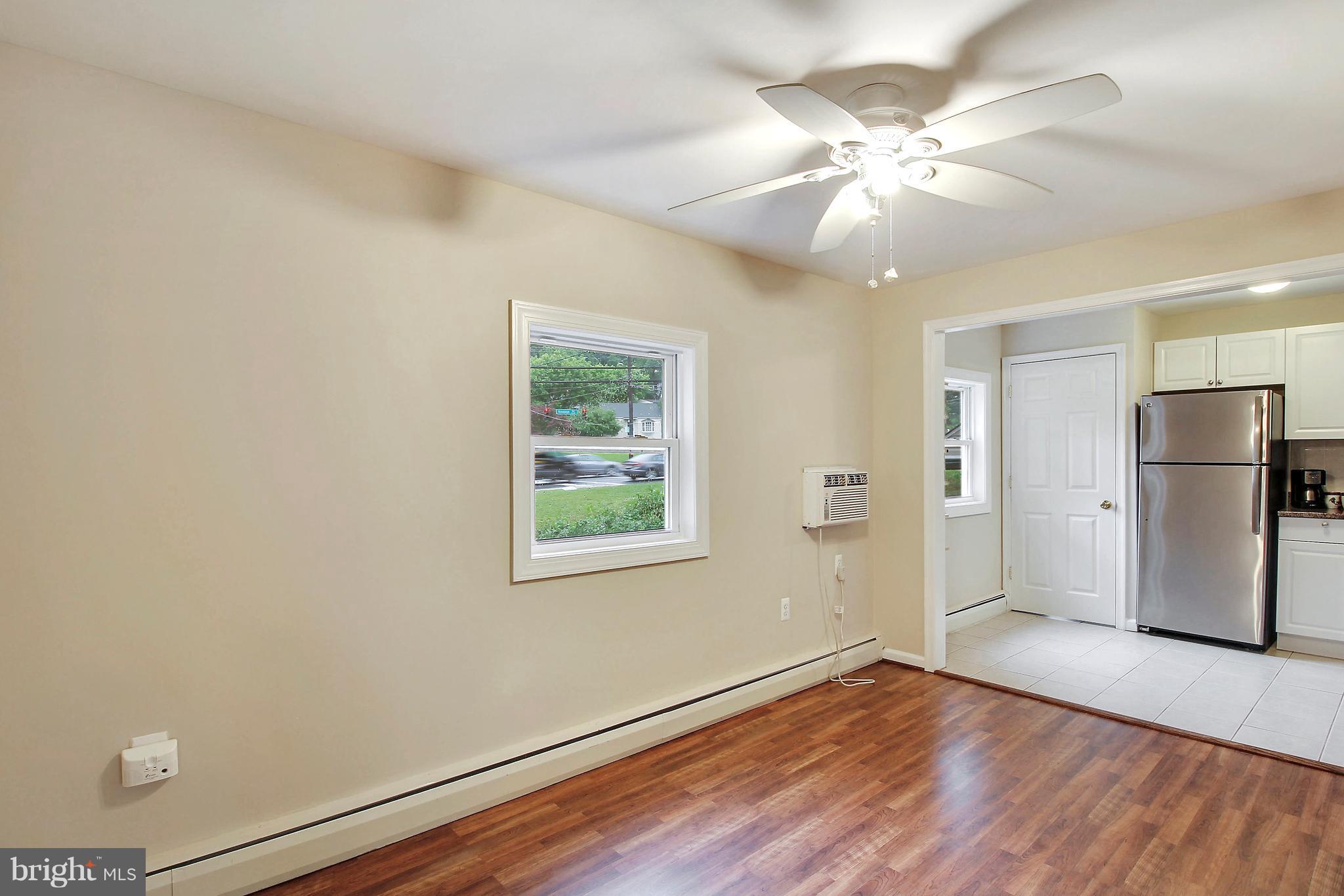 12014 Dewey Road Silver Spring, MD 20906 - Photo 11 of 30 Dining Room wit laminate floor and new windows