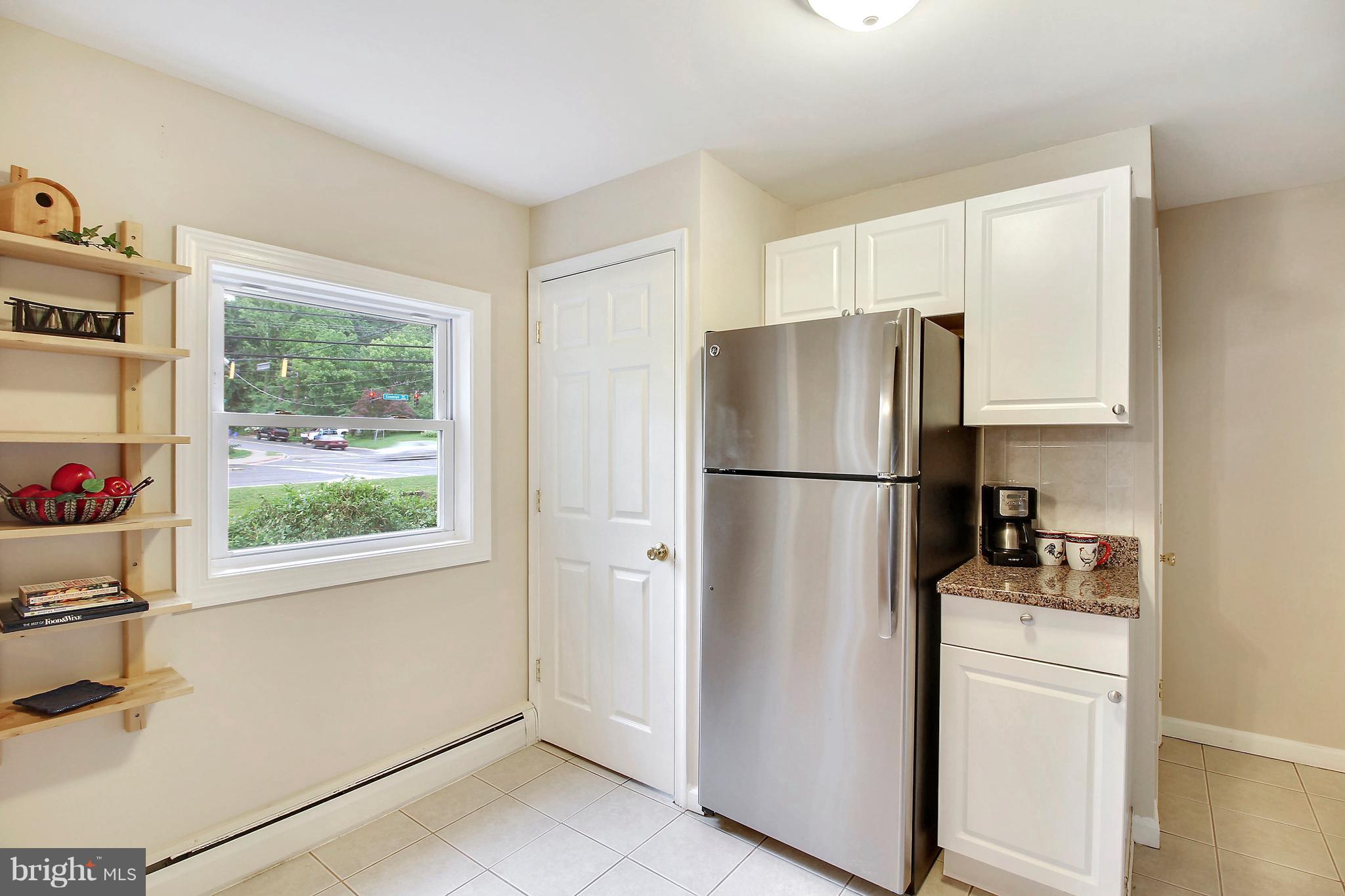 12014 Dewey Road Silver Spring, MD 20906 - Photo 13 of 30 Kitchen with built in shelving, pantry