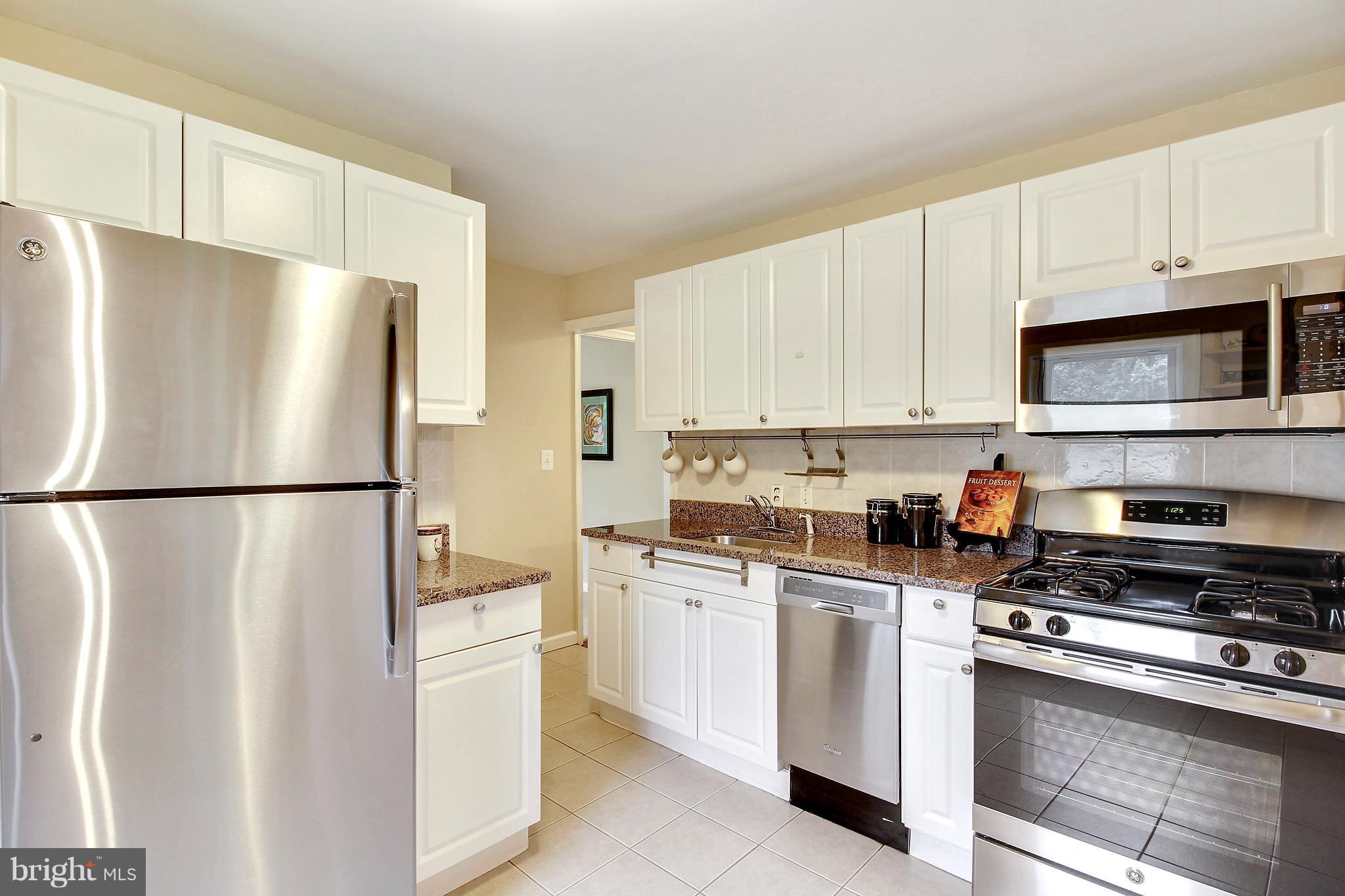 12014 Dewey Road Silver Spring, MD 20906 - Photo 14 of 30 Kitchen with new SS appliances, granite, pantry