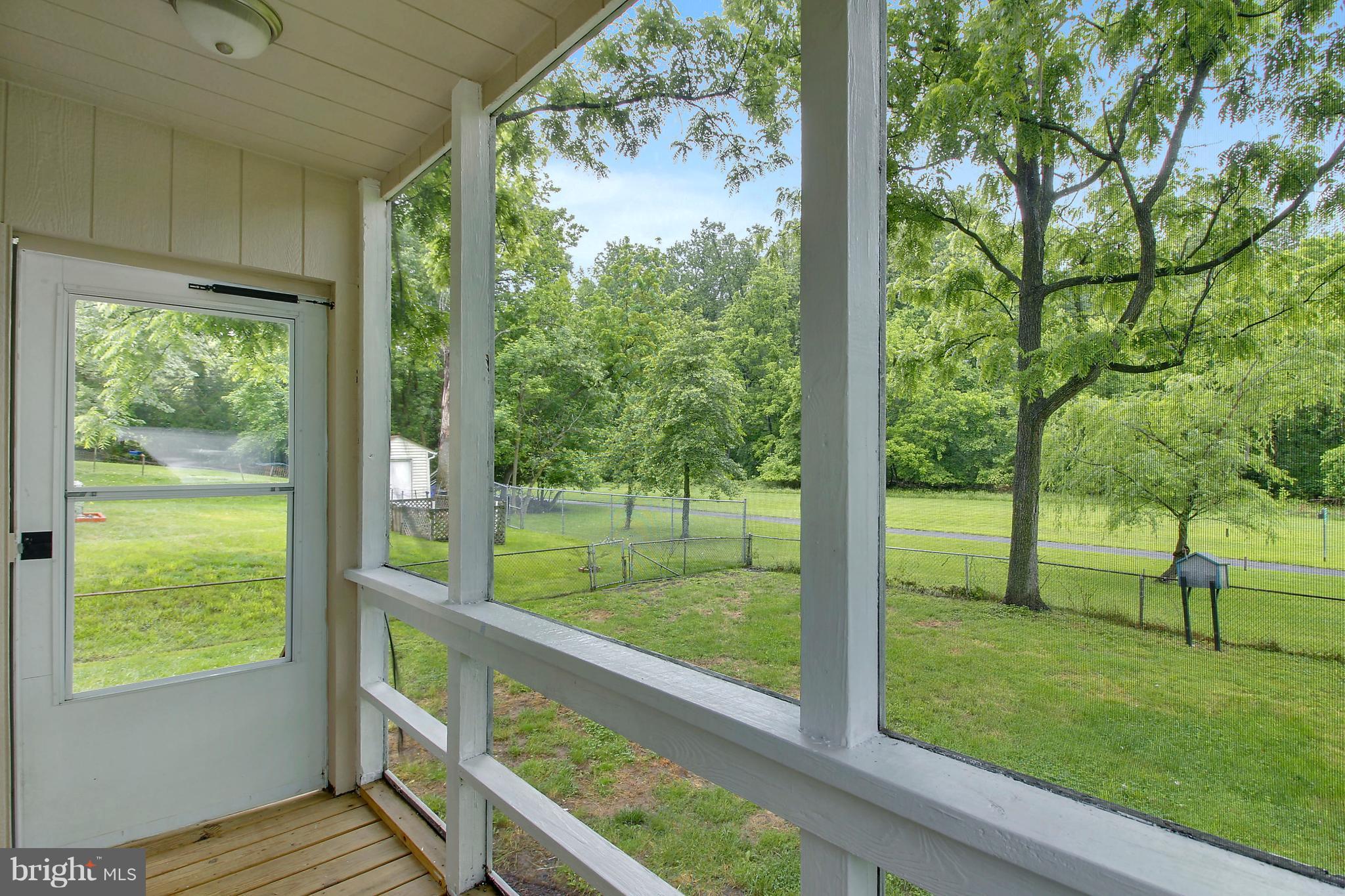 12014 Dewey Road Silver Spring, MD 20906 - Photo 3 of 30 Porch overlooking picturesque flat, fenced yard