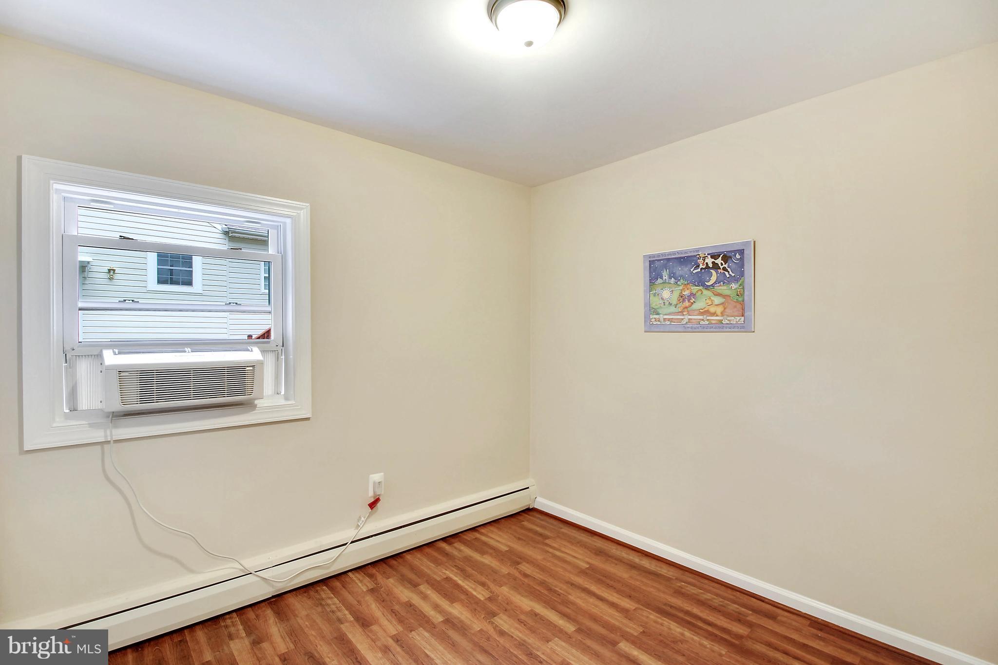 12014 Dewey Road Silver Spring, MD 20906 - Photo 25 of 30 Bedroom 3 with laminate flooring