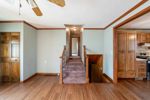 an empty room with windows and closet