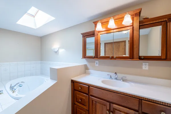 a bathroom with a bathtub and a shower