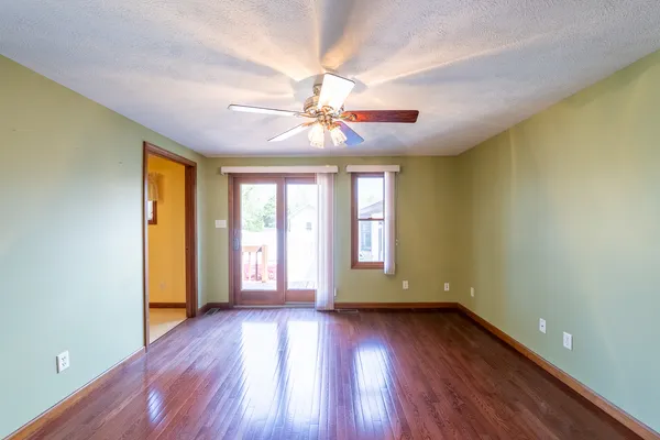 a view of a room with rack on the wall and a window