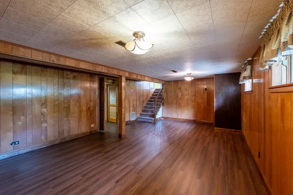 a view of an entryway with wooden floor