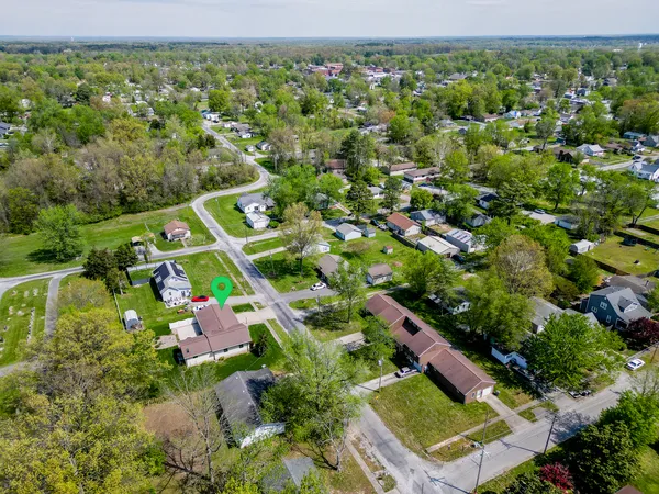 an aerial view of house with yard