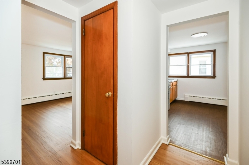13 Knapp Avenue Clifton, NJ 07011 - Photo 14 of 17 a view of an empty room and wooden floor