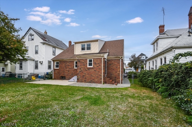 13 Knapp Avenue Clifton, NJ 07011 - Photo 4 of 17 a front view of a house with a yard