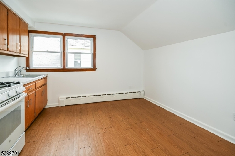 13 Knapp Avenue Clifton, NJ 07011 - Photo 7 of 17 a view of a kitchen with a stove top oven