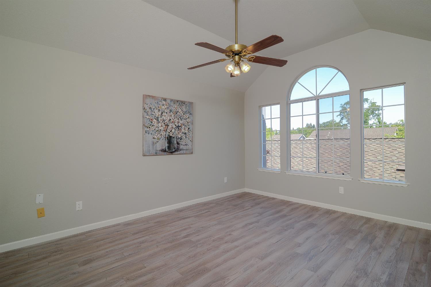 4055 Alex Lane Carmichael, CA 95608 - Photo 16 of 47 a view of an empty room with wooden floor and a window
