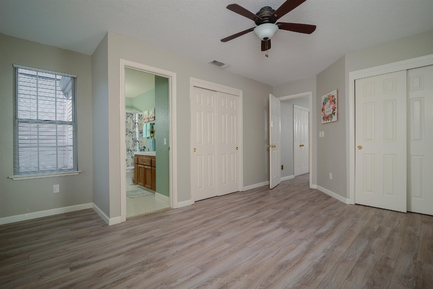 4055 Alex Lane Carmichael, CA 95608 - Photo 20 of 47 a view of an empty room with window and wooden floor