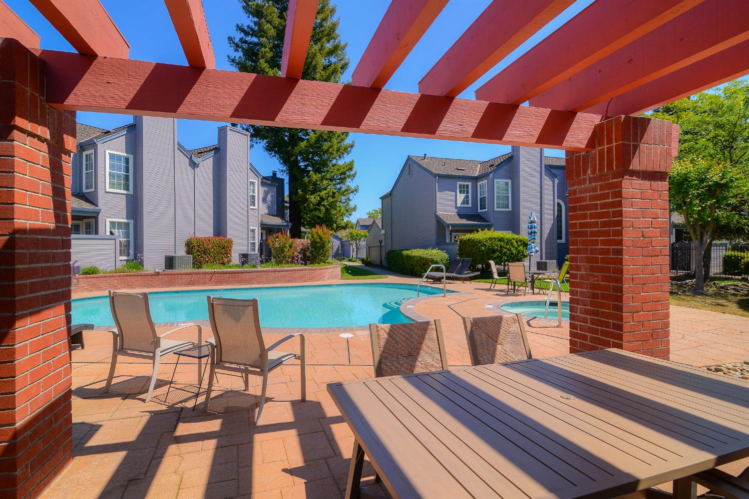 4055 Alex Lane Carmichael, CA 95608 - Photo 26 of 47 a view of a patio with table and chairs potted plants with wooden floor and fence