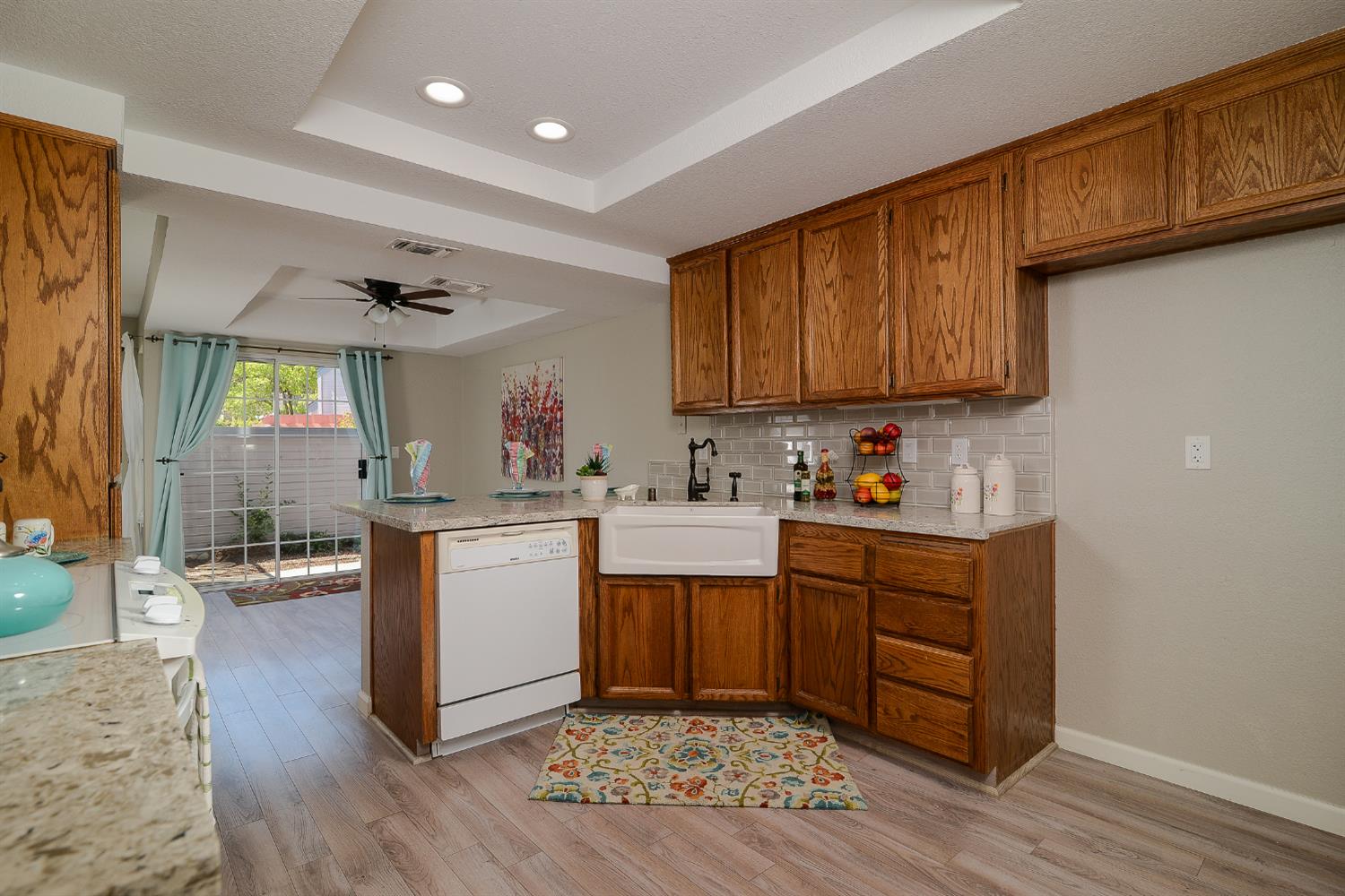 4055 Alex Lane Carmichael, CA 95608 - Photo 3 of 47 a kitchen with sink cabinets and wooden floor