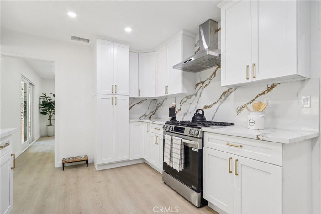 11060 Vanda Way Sun Valley, CA 91352 - Photo 11 of 43 a kitchen with stainless steel appliances granite countertop a stove and a refrigerator