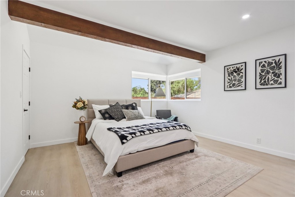 11060 Vanda Way Sun Valley, CA 91352 - Photo 19 of 43 a bedroom with a bed and wooden floor