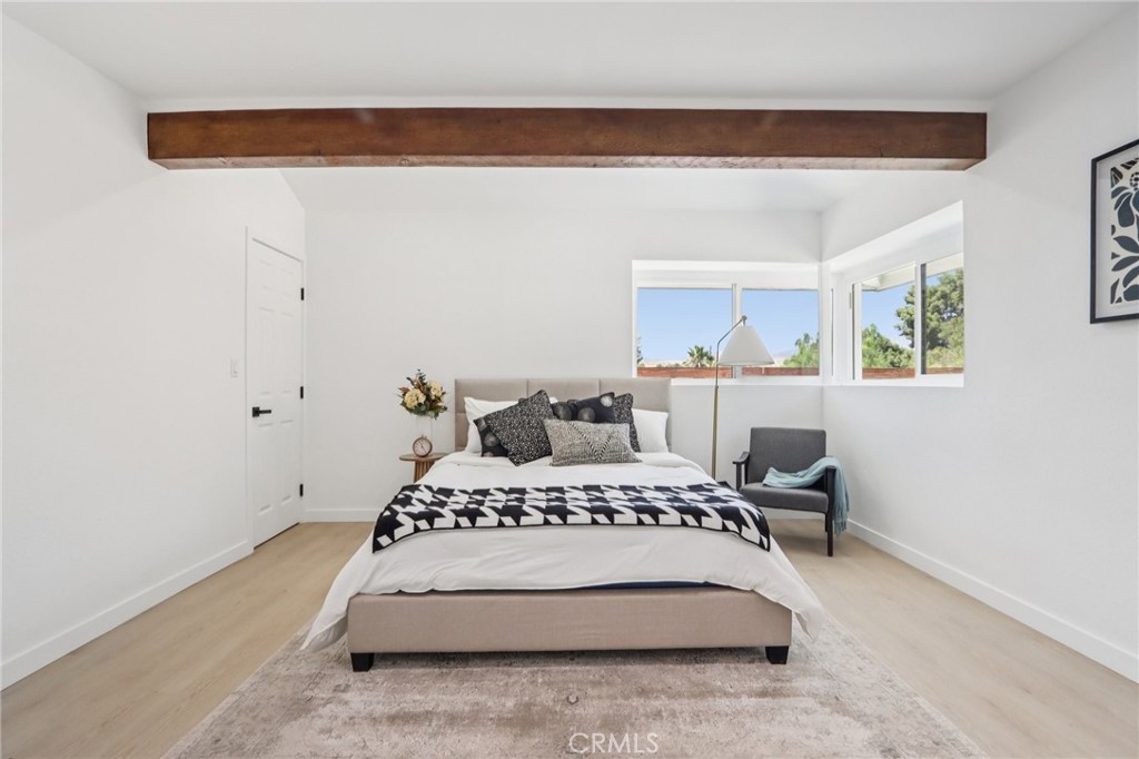 11060 Vanda Way Sun Valley, CA 91352 - Photo 20 of 43 a spacious bedroom with a bed and a cabinets